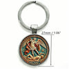 Silver keychain featuring an oval pendant depicting the Saint Michael Archangel.