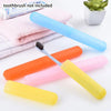 Various colored portable toothbrush storage cases and a single toothbrush are displayed on a white background.