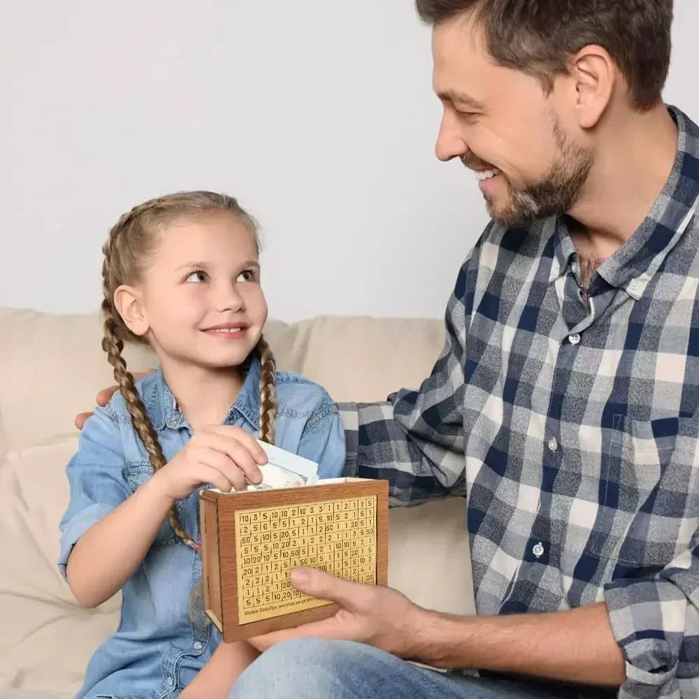 A smiling man is showing a young girl a reusable wooden piggy bank for saving goals.