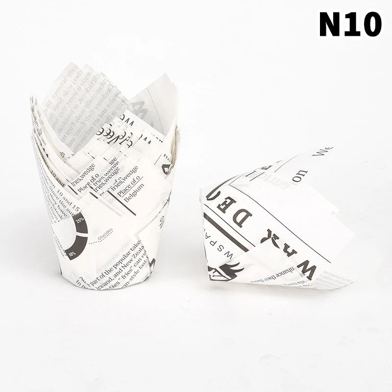 A stack of white tulip cupcake liners for baking
