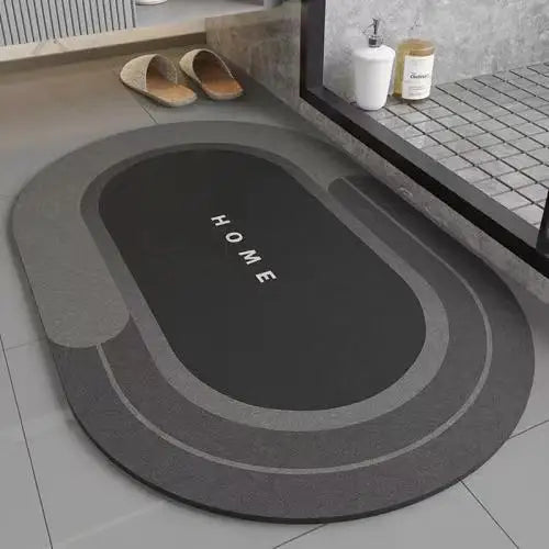 A round, dark gray anti-slip floor mat with concentric rings is displayed on a light tiled floor.