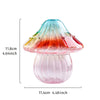 A translucent pink and orange glass mushroom vase with a clear dome and ribbed base.