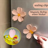 Pink magnetic sealing clips used as refrigerator stickers for securing food and bags