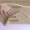 A hand touches a tan waffle texture bath mat highlighting comfort touch, durable edge, and slip-resistant features.