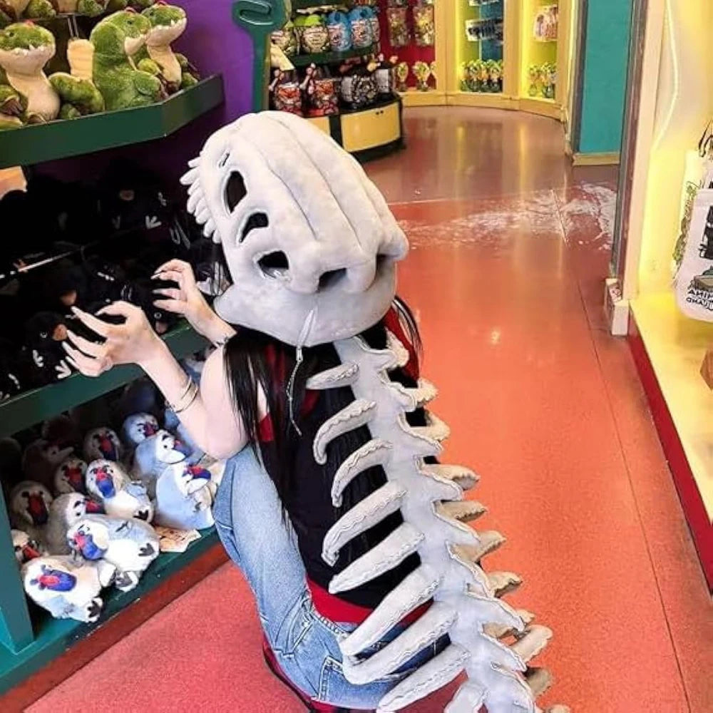 A person wearing a white dinosaur skeleton costume with a long spine and ribs, standing in a retail store.