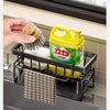 A black kitchen sponge holder and drain rack with a hanging hook is shown next to a window sill.