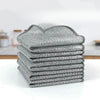 A stack of gray textured multipurpose non-stick cleaning cloths for kitchen and dishes.