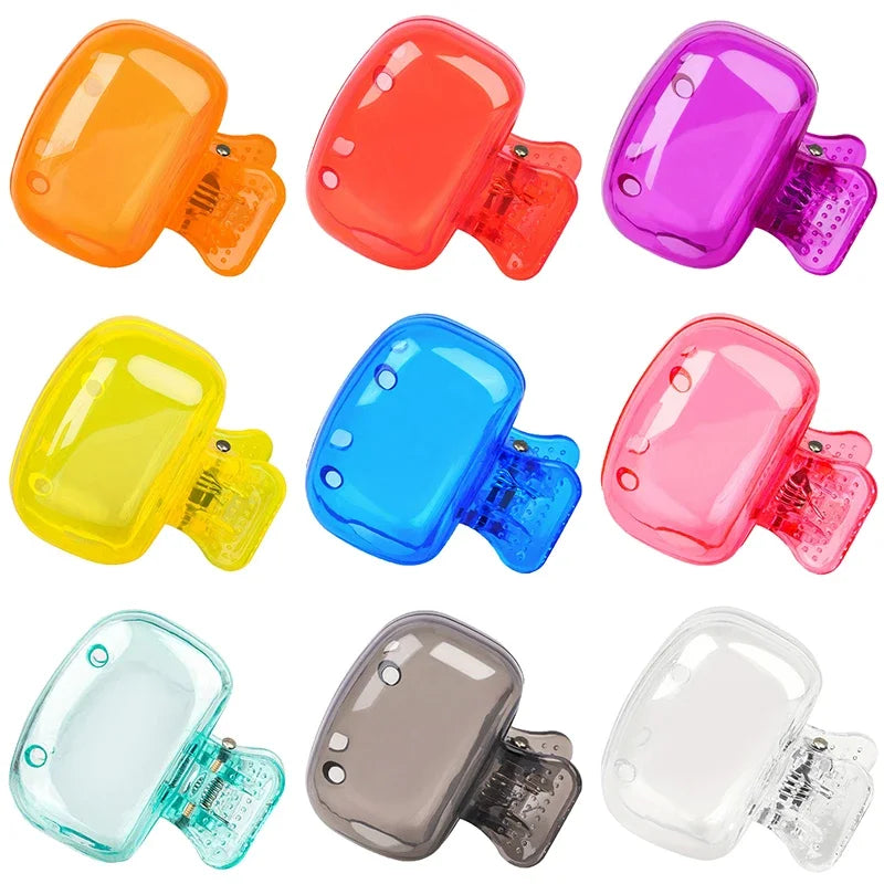 A collection of various colored protective caps designed for toothbrush holders.