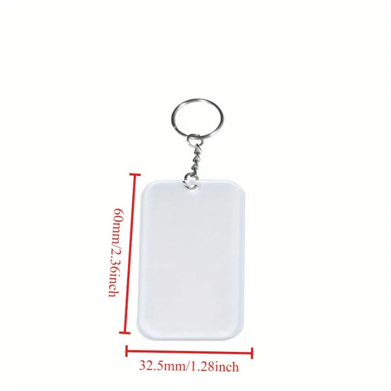 A white rectangular acrylic keychain with a silver split ring attached.