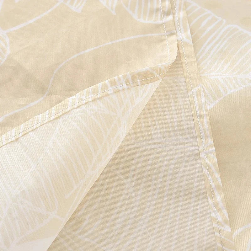 A close-up of a beige tropical sea life patterned shower curtain fabric.