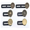 A set of black button extenders with round brass or gold-colored buttons for clothing