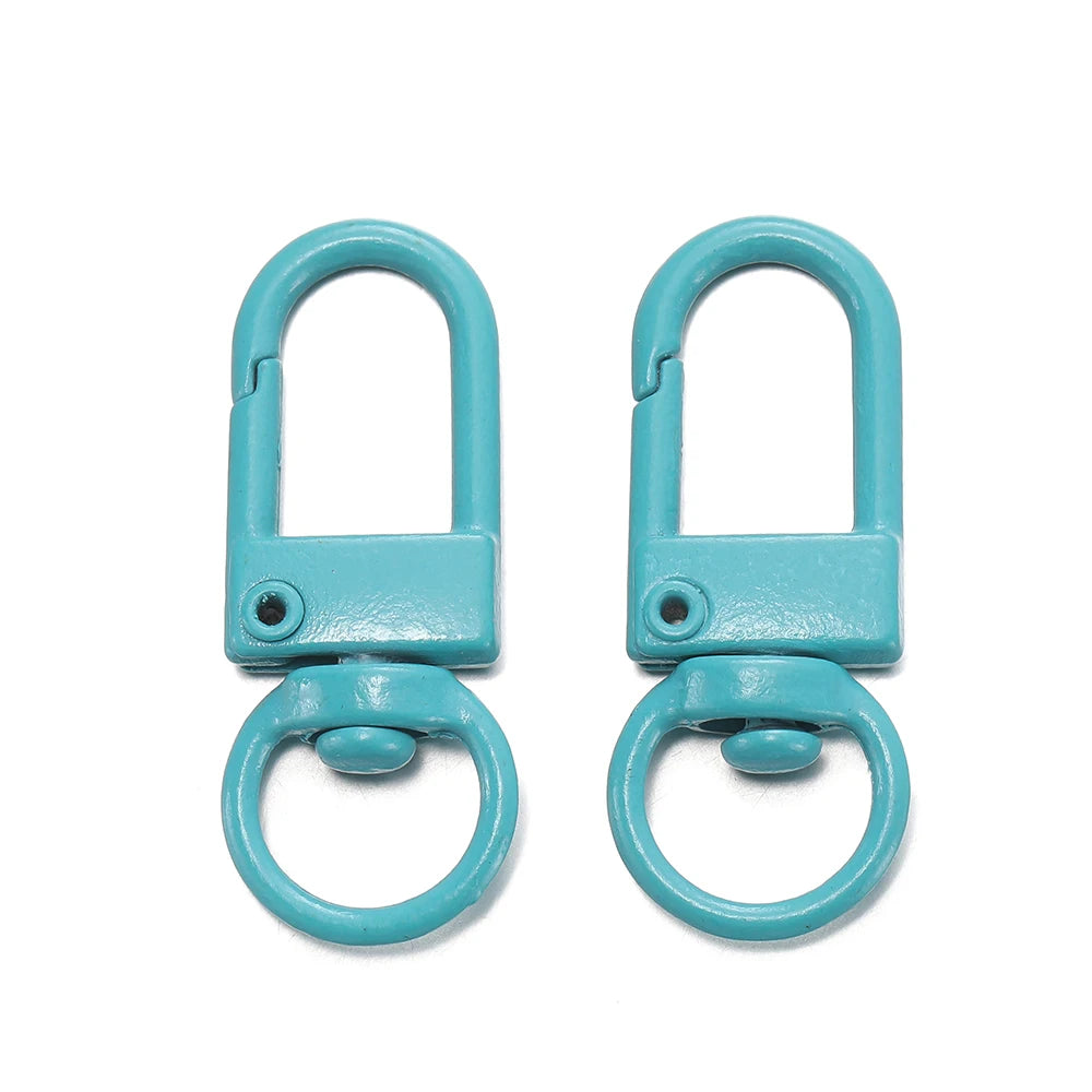 A pair of teal alloy snap lobster clasp hooks for jewelry making.