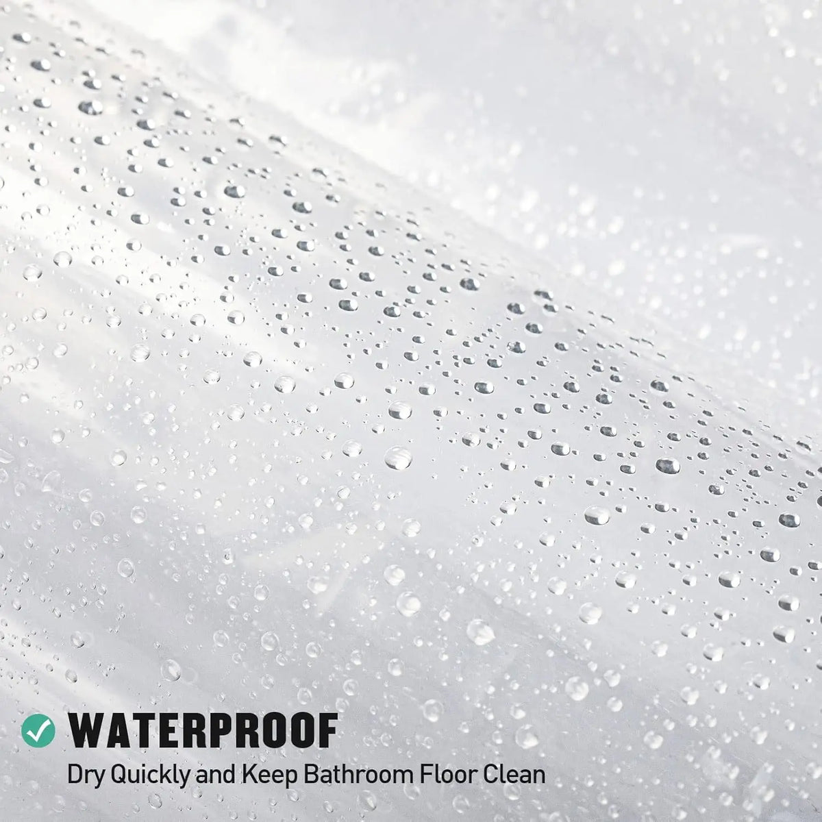 Close-up of a clear waterproof shower curtain liner with weighted magnets on a wet surface.