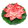 A vibrant pink artificial lotus flower blooming on a green leaf.