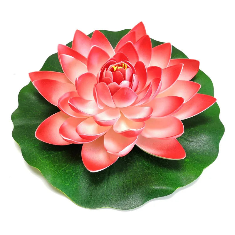 A vibrant pink artificial lotus flower blooming on a green leaf.