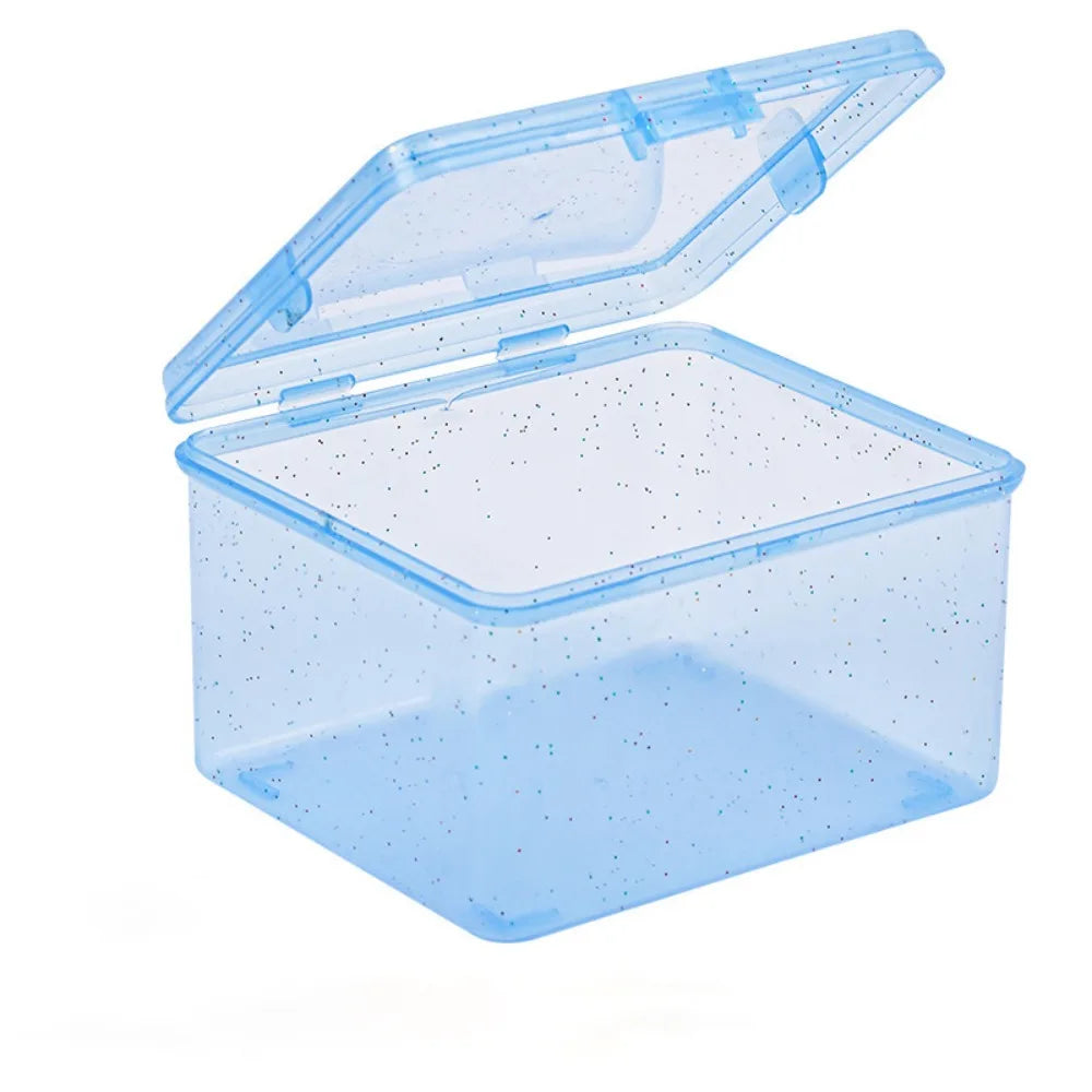 A clear plastic storage box with a lid is shown, designed for storing jewelry and small items.
