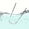 A stainless steel tongue scraper set is shown submerged in clear water with ripples and bubbles.
