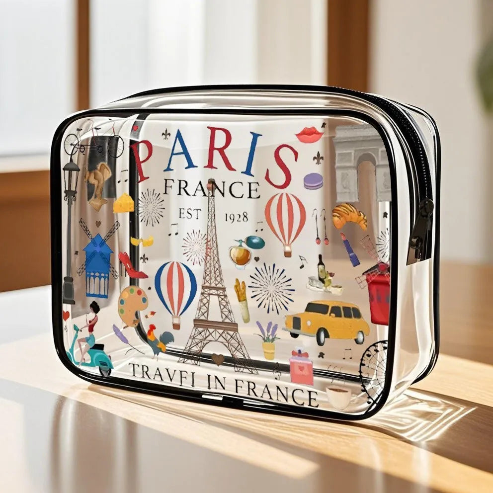 A clear waterproof travel organizer pouch featuring a Paris France theme with Eiffel Tower and hot air balloons.