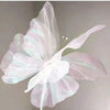 A delicate, translucent white and pink 3D simulated butterfly decoration with delicate wings.