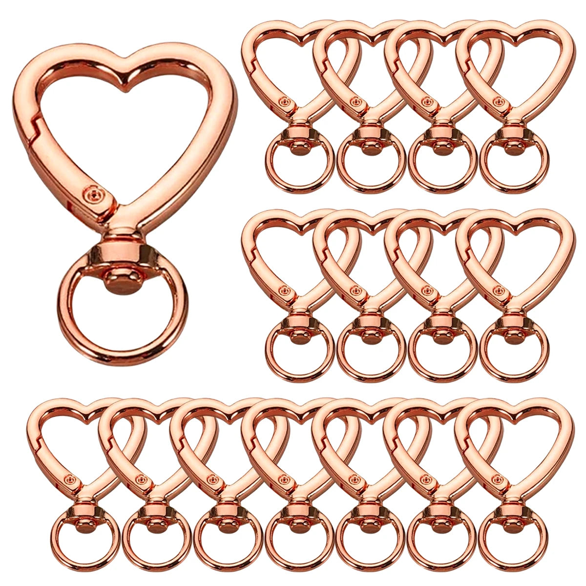 A set of rose gold heart-shaped spring hook keychains.