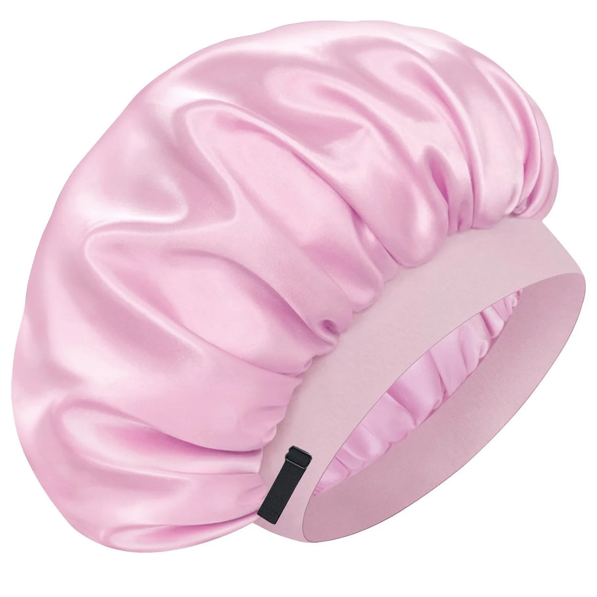 A pink silk sleep cap with gathered fabric and a black strap.