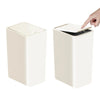 A white 10L small trash can with a press-fit lid is shown, being lifted by a hand.
