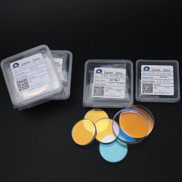 A set of clear plastic containers holding laser lenses and colored liquid samples for testing.