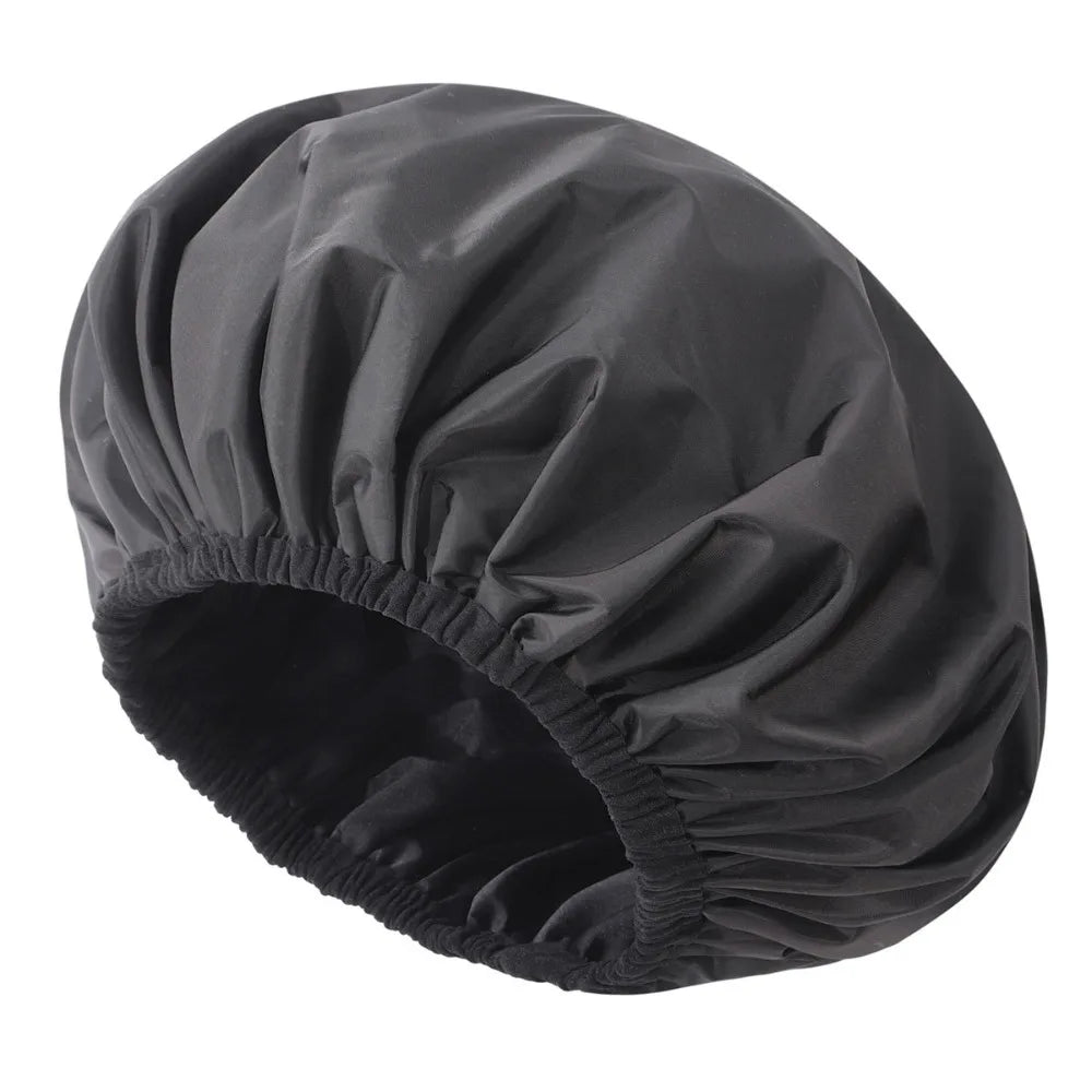 Black reusable satin lined shower cap shown from above