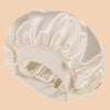 A white satin wide brim shower cap folded and displayed on a neutral background.
