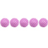 A row of pink reusable laundry balls for clothes and machines