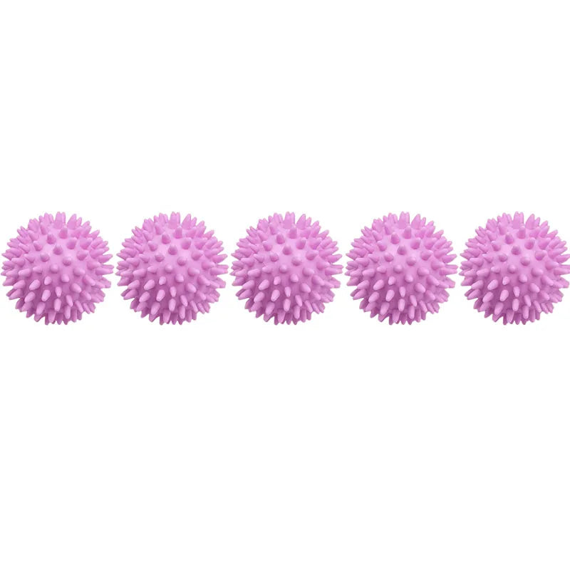 A row of pink reusable laundry balls for clothes and machines