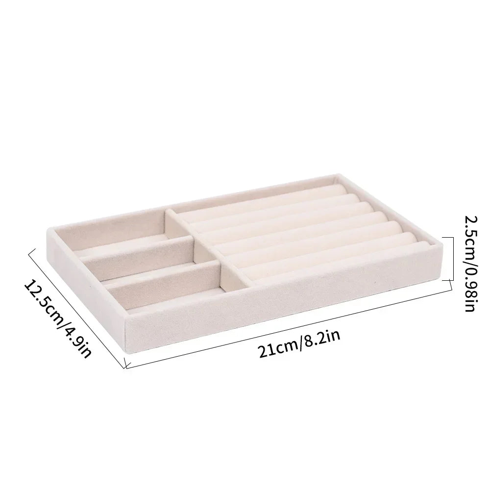 A rectangular velvet jewelry organizer tray with a soft lining, showing its dimensions.