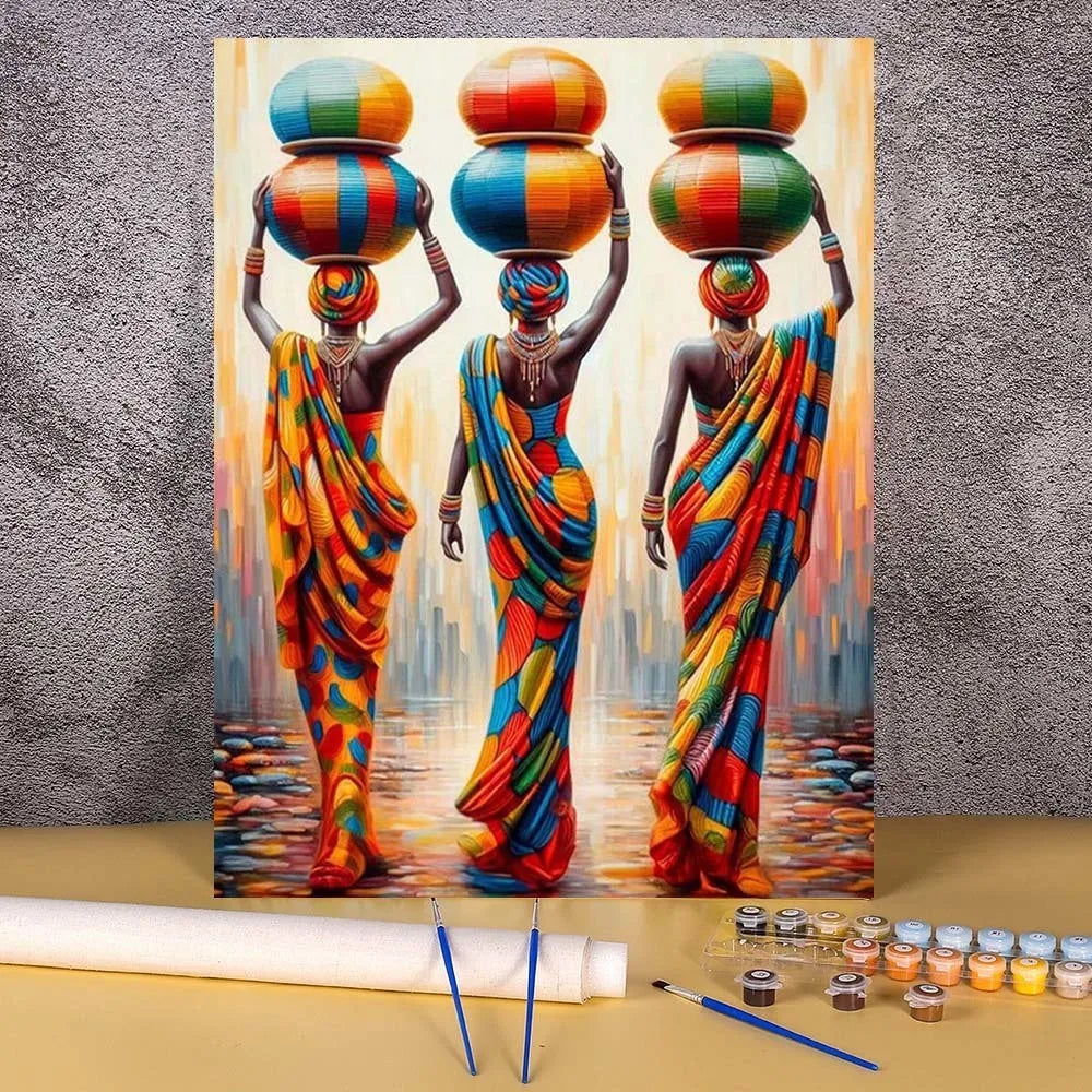 Three women in colorful sarees stand against a cityscape background on an art canvas.