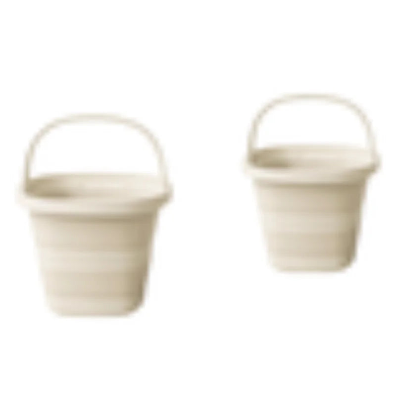 A beige collapsible water bucket with a handle, shown from the side.