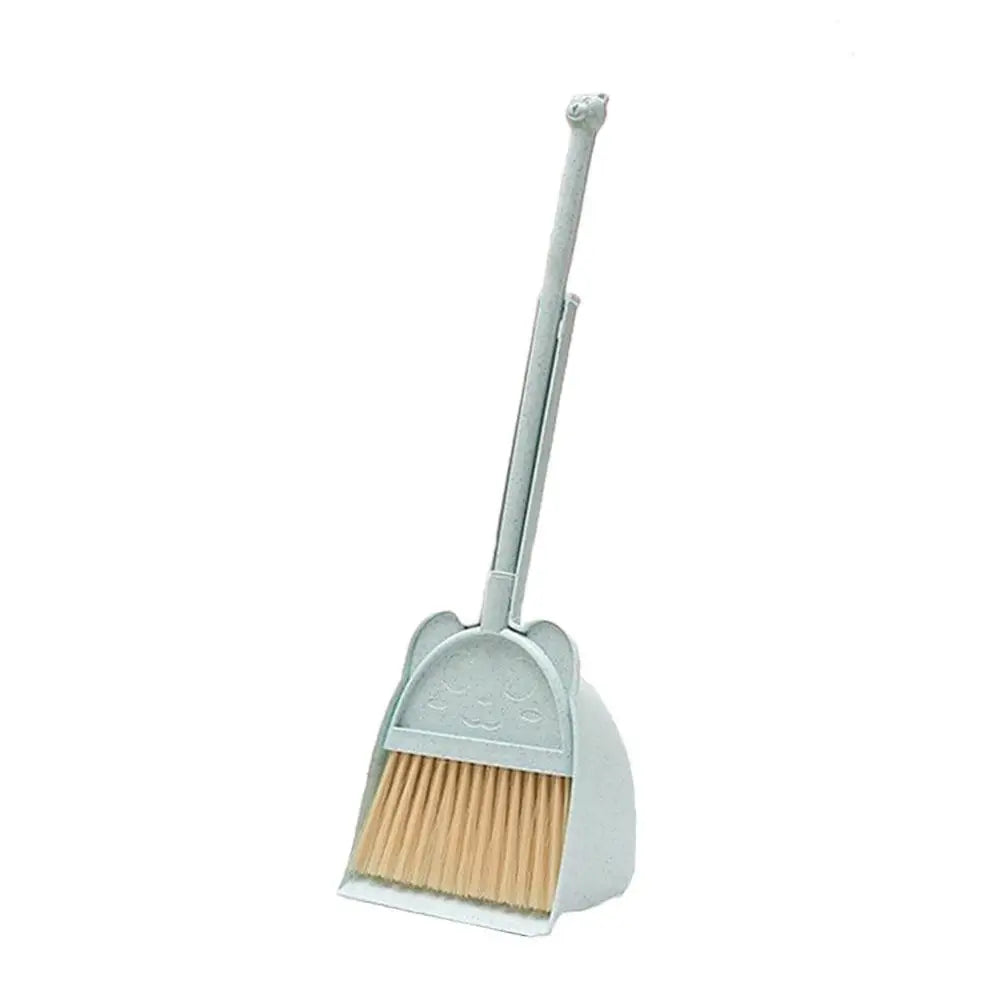 A silver toddler mini broom and dustpan set with a handle and brush.