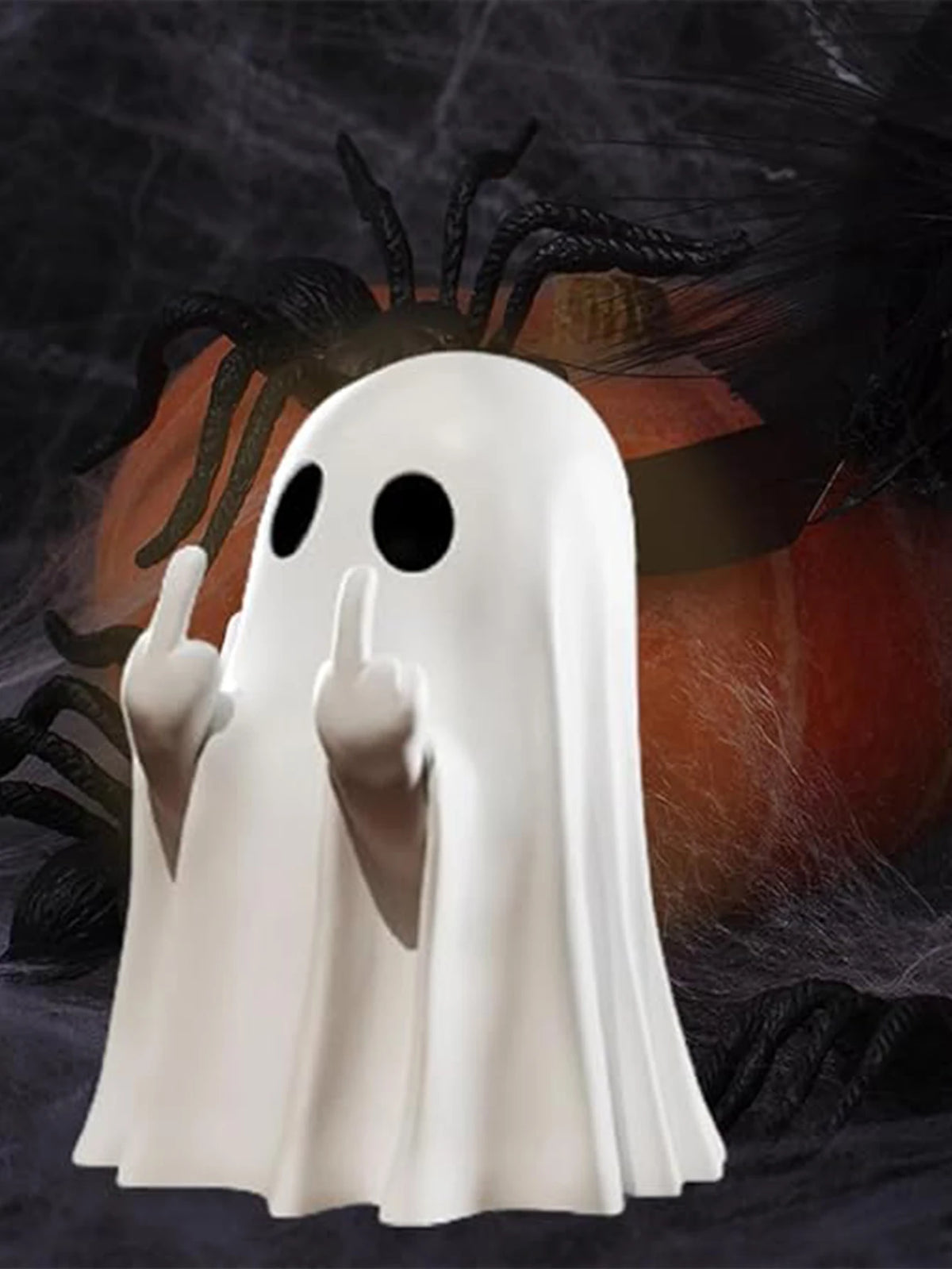 A white ghost statue decoration with outstretched hands against a dark background.