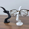 A minimalist 3D printed profile eyeglass stand featuring a black and white design.