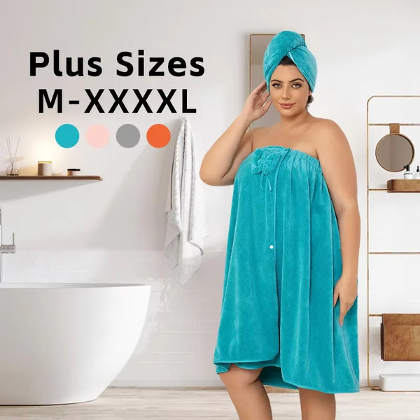 A woman models a teal plus size wrap robe and turban set in a bright bathroom setting.