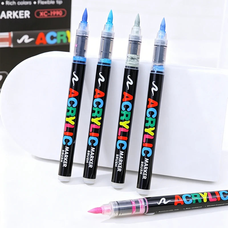 A set of nine black acrylic markers with colorful tips displayed on a white background.