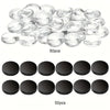 A collection of clear glass refrigerator magnets and black circular magnets are displayed.