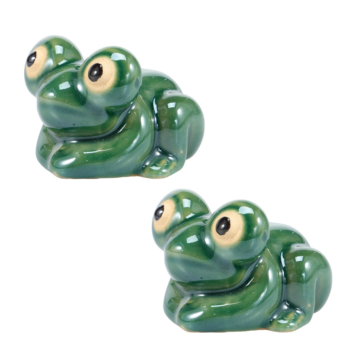 A pair of glossy green ceramic toilet bolt covers shaped like small frogs.