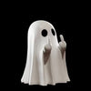 A white ghost statue decoration with raised index fingers against a black background.