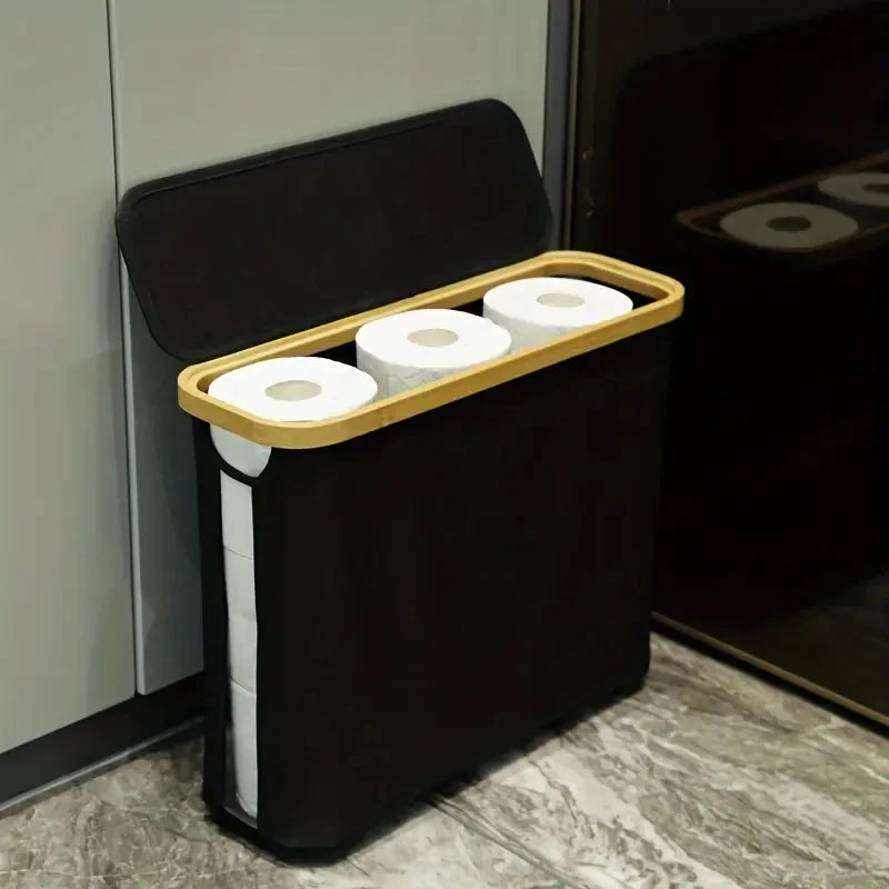 A black bamboo storage basket with a lid is shown, containing several rolls of white paper towels.