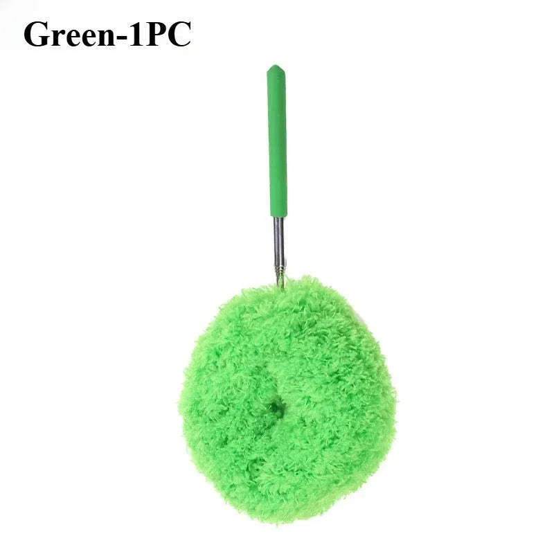 Green microfiber duster with a long handle and a fluffy green head