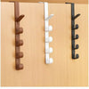 A close-up view of a wooden door hook rack with three different colored hooks for closet storage.