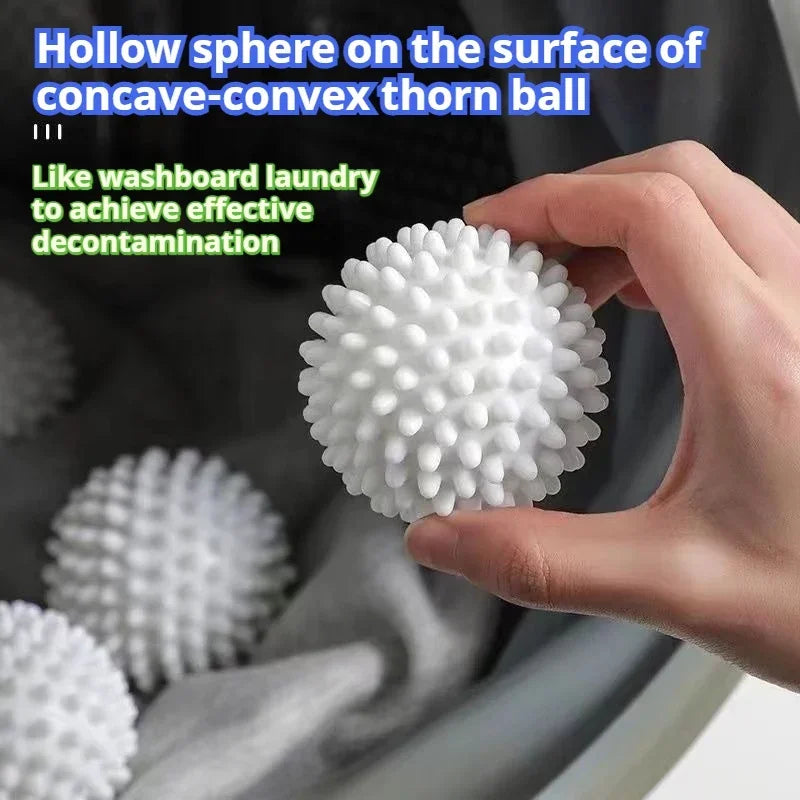 A hand holds a white silicone laundry ball on the surface of a concave-convex thorn ball.