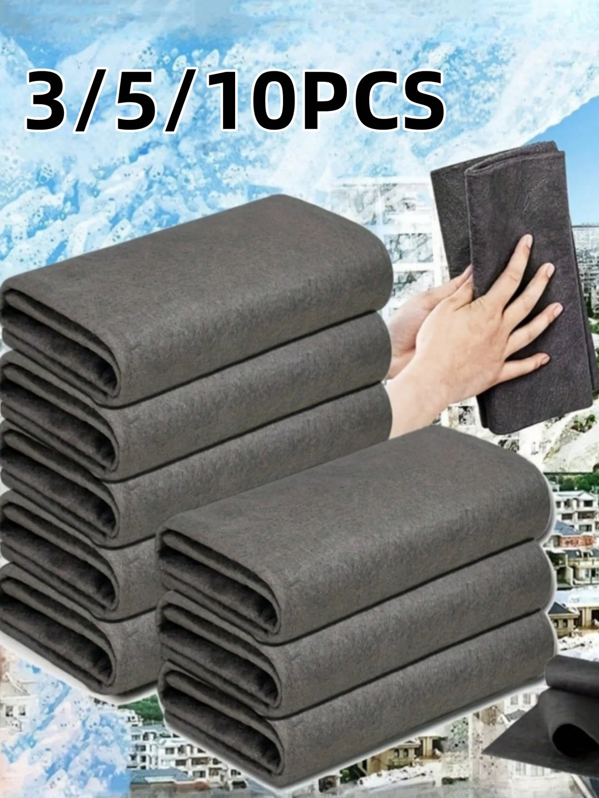 A stack of dark gray reusable microfiber cleaning cloths is shown against a snowy outdoor background.