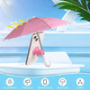 Pink umbrella sunshade with suction cups protecting a smartphone against the sun on water.