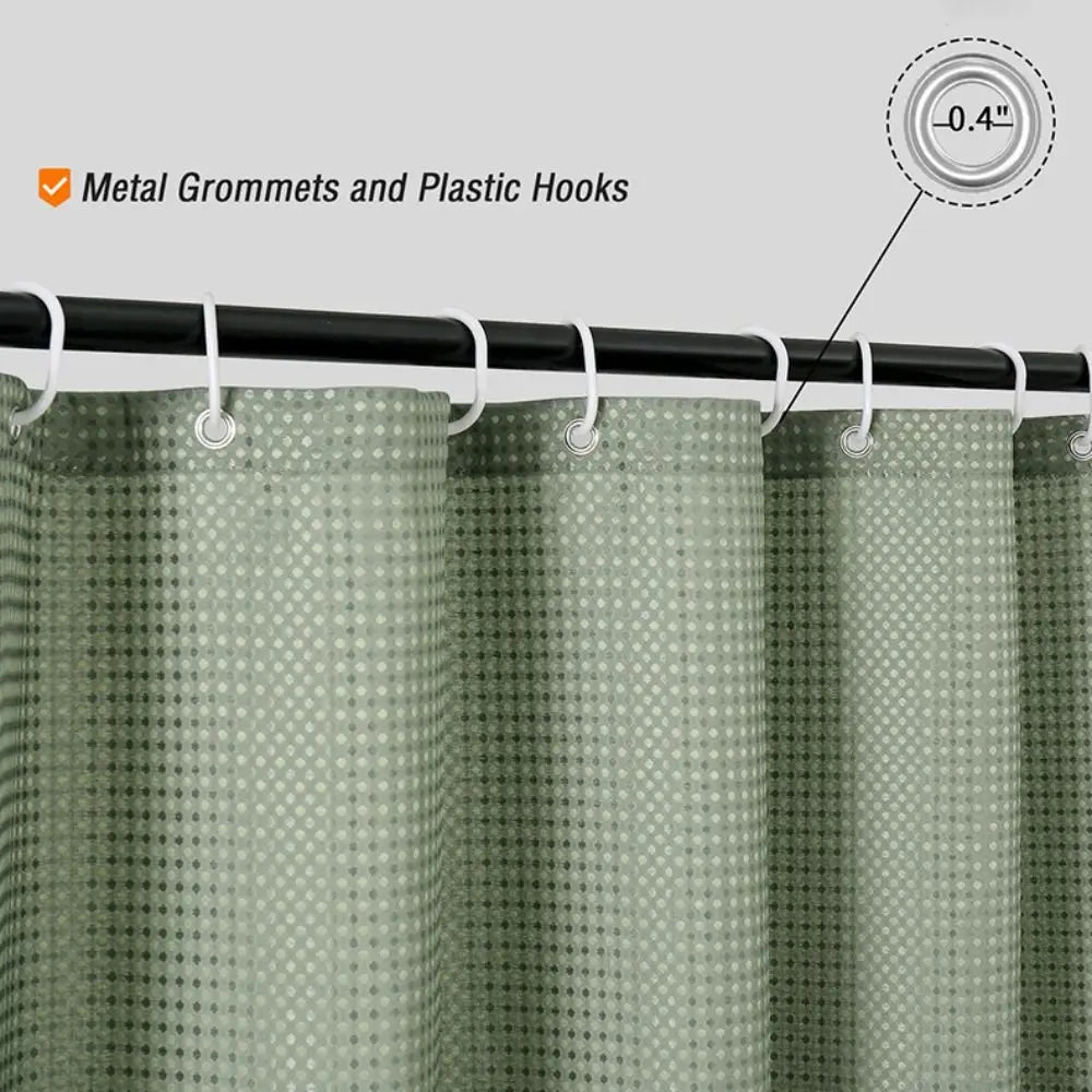 A close-up view of a light green waterproof shower curtain with metal grommets and plastic hooks.
