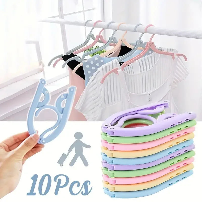 A set of 10 purple and white portable foldable clothes hangers displayed next to a hand and a person icon.